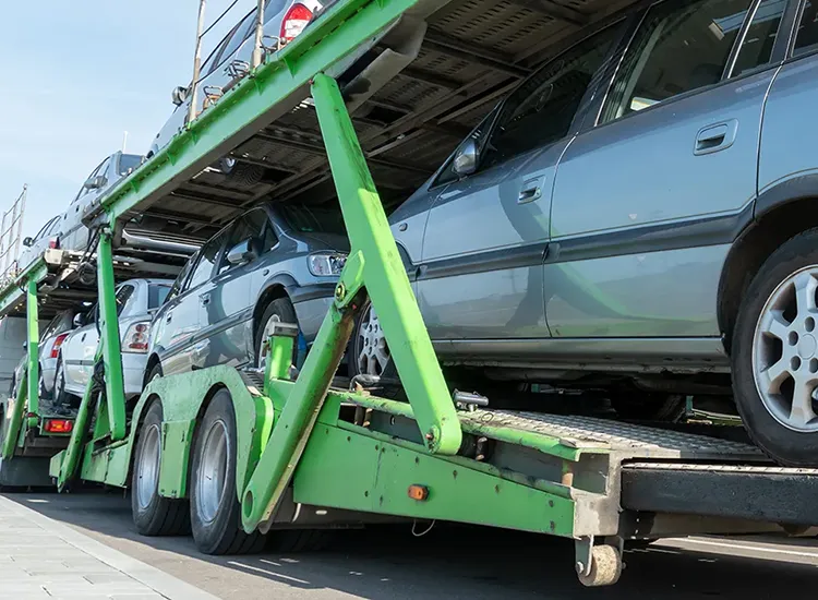 Car loaded on trailer ready for transportation