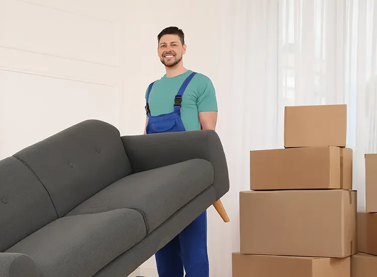 Gurgaon Movers staff moving a sofa