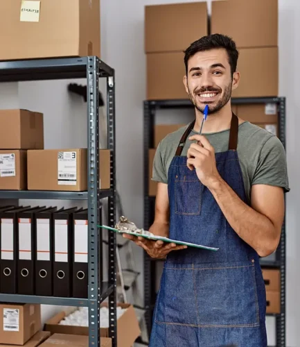 A mover staff smiling and writing item list